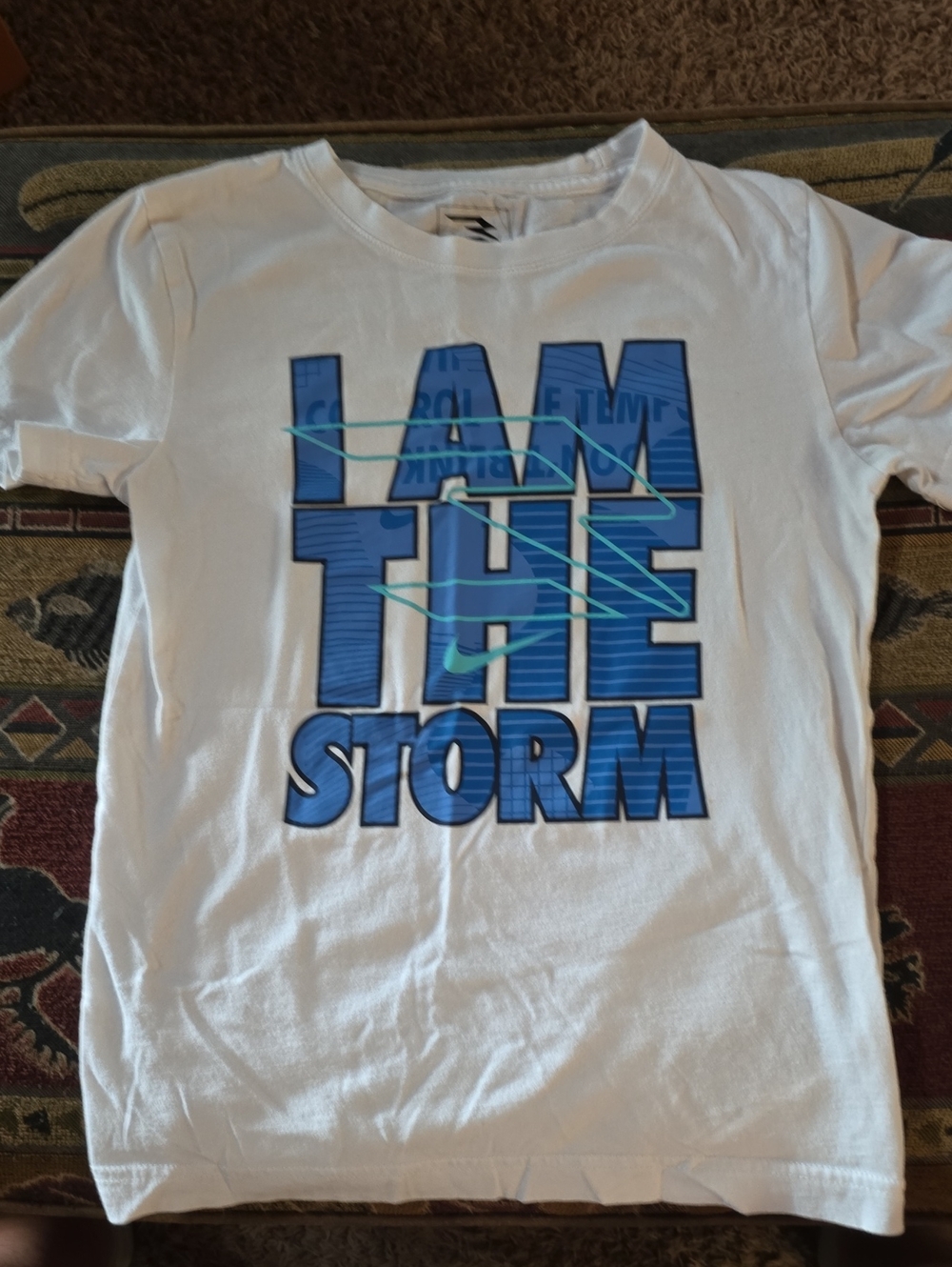 Nike White Tee with Blue "I AM THE STORM" Graphic